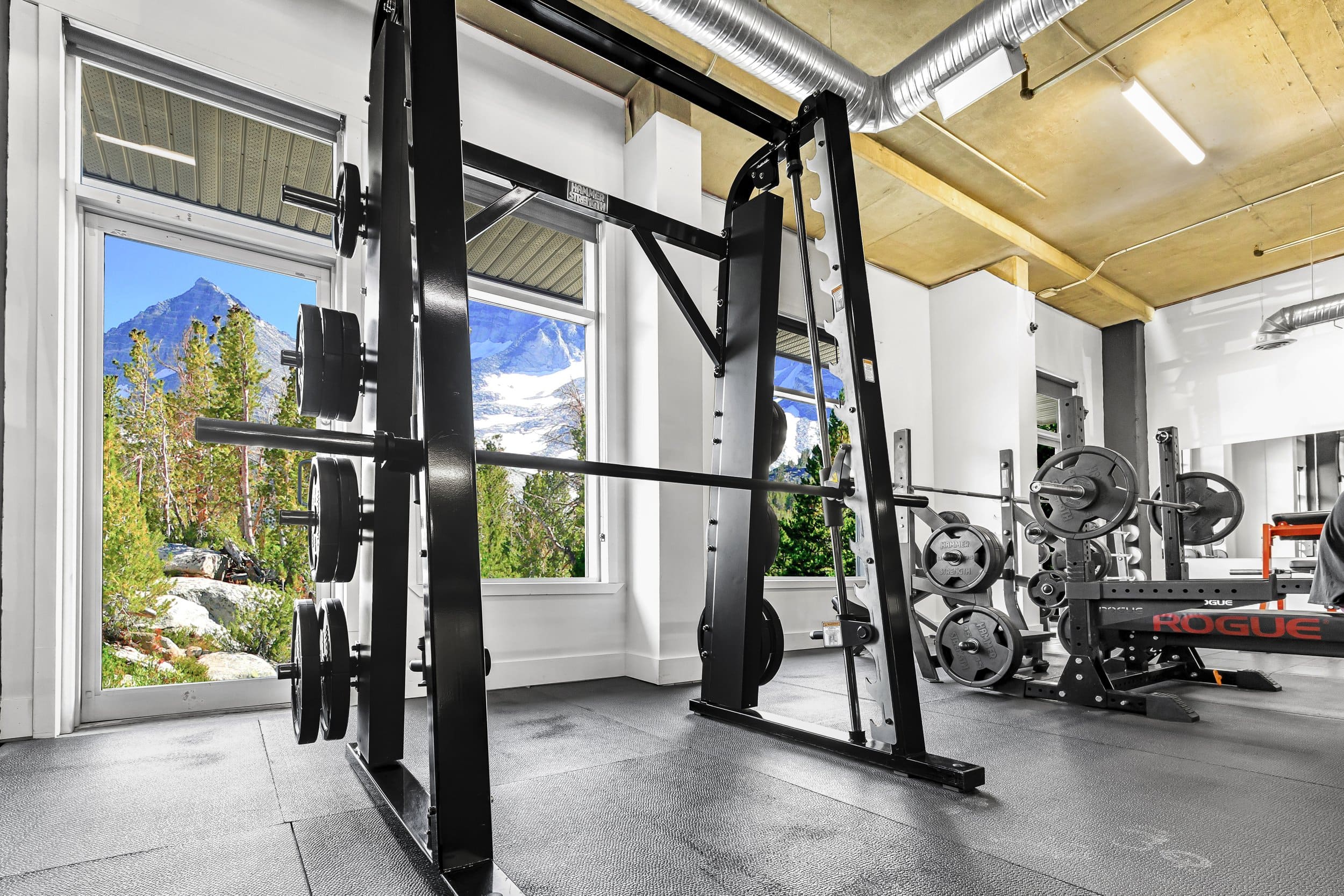 Smith machine and free weight racks at Athletic Evolution in Canmore