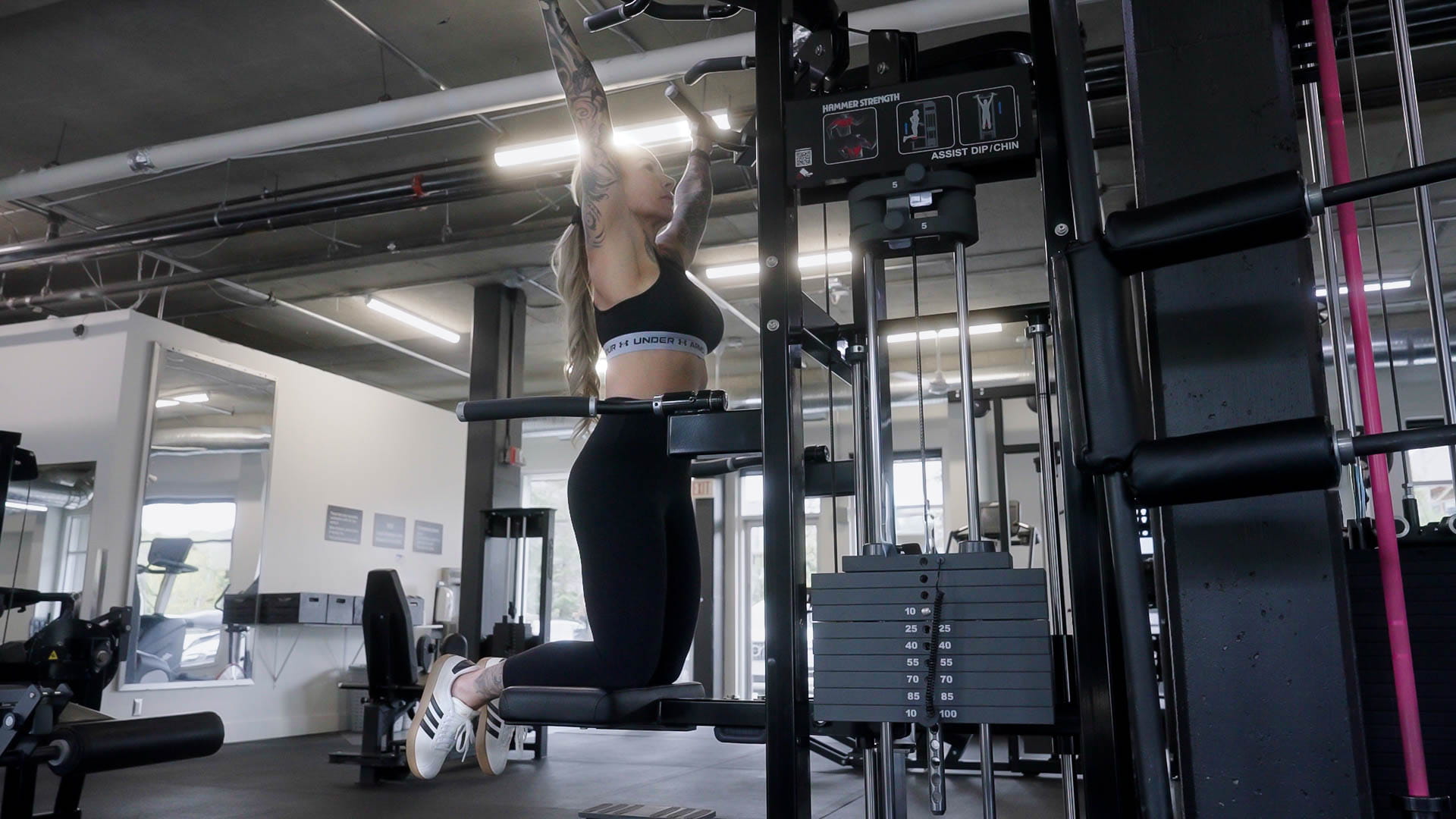 Counter-weighted assisted pull-up machine at Athletic Evolution
