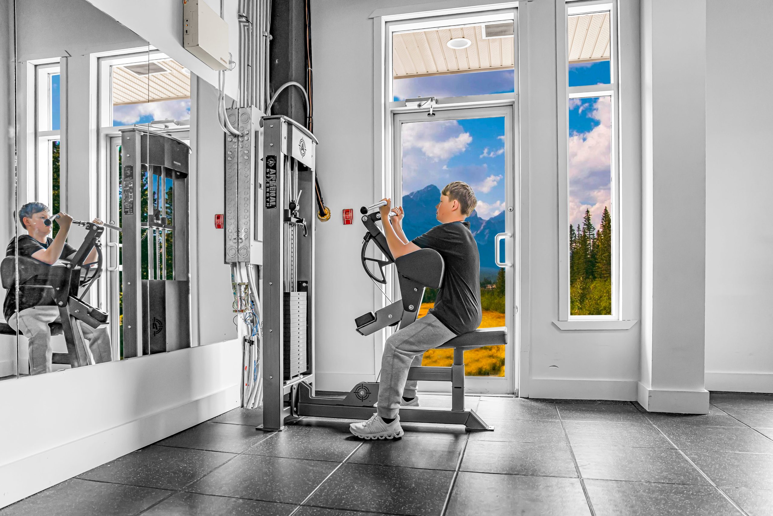 Preacher curl bench with EZ-curl bar at Athletic Evolution